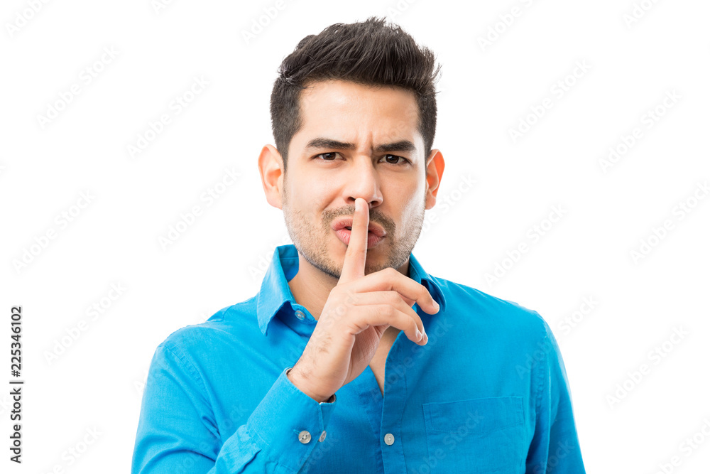 © AntonioDiaz - Man Gesturing Silence With Finger On His Lips