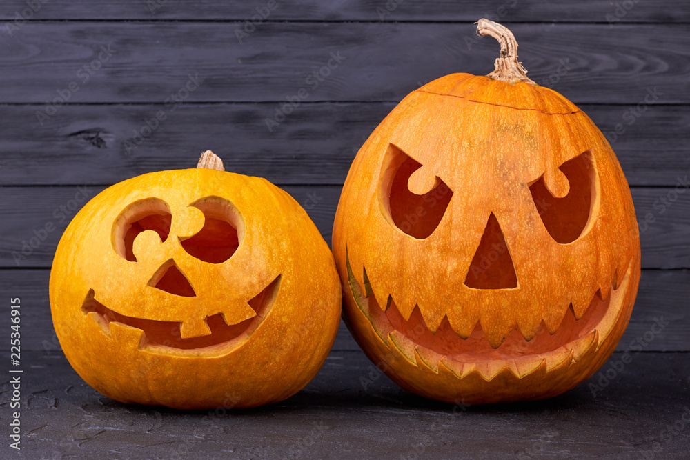 Two Halloween pumpkins on wooden background. Funny and angry pumpkins for Halloween. Cute pumpkin carving ideas. Stock Photo | Adobe Stock Two Halloween pumpkins on wooden background. Funny and angry pumpkins for Halloween. Cute pumpkin carving ideas. Stock Photo | Adobe Stock