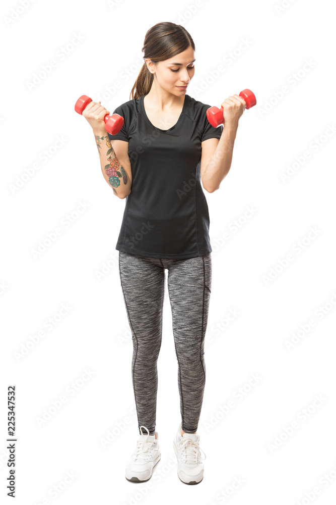 Active Female Working Out With Weights On White Background Active Female Working Out With Weights On White Background