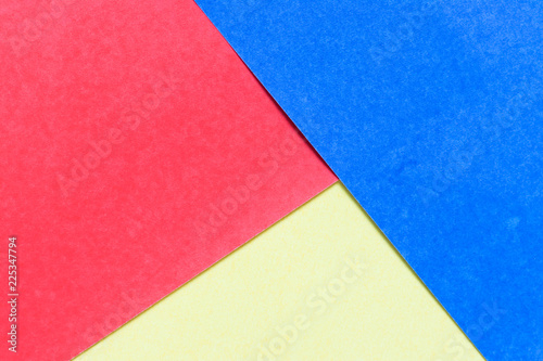 Abstract red, yellow, blue color paper background for design and decoration