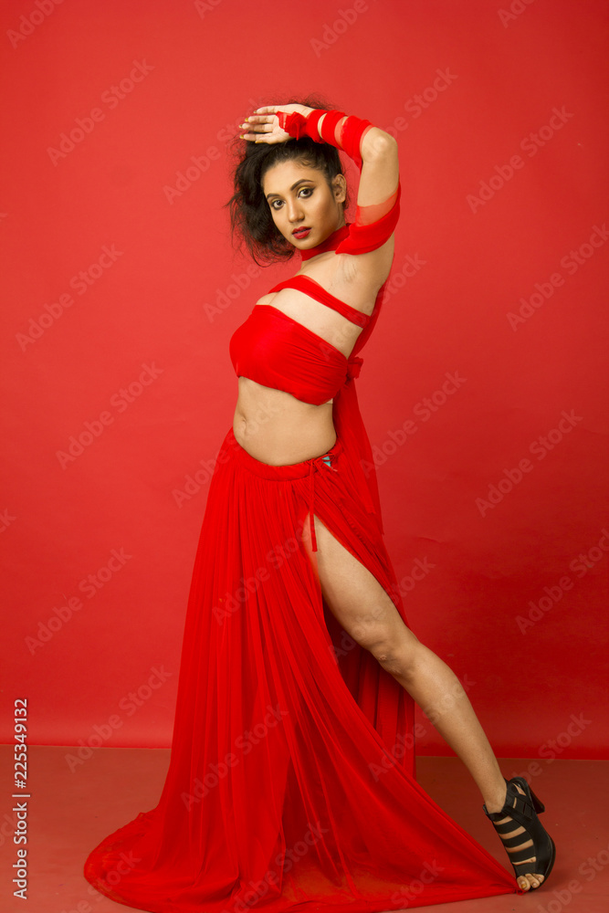 beautiful indian female model in a red flowy dress beautiful indian female model in a red flowy dress