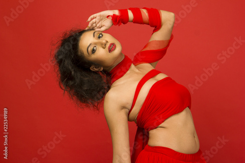 beautiful indian female model in a red flowy dress