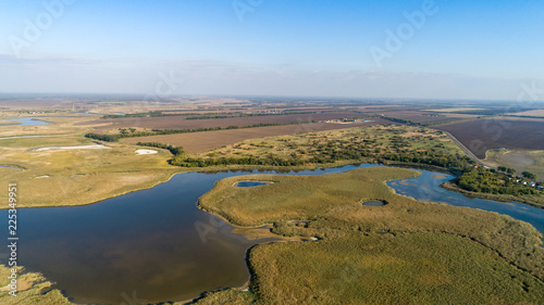 Aerial view of the village and the river in Russia in the summer at sunset
