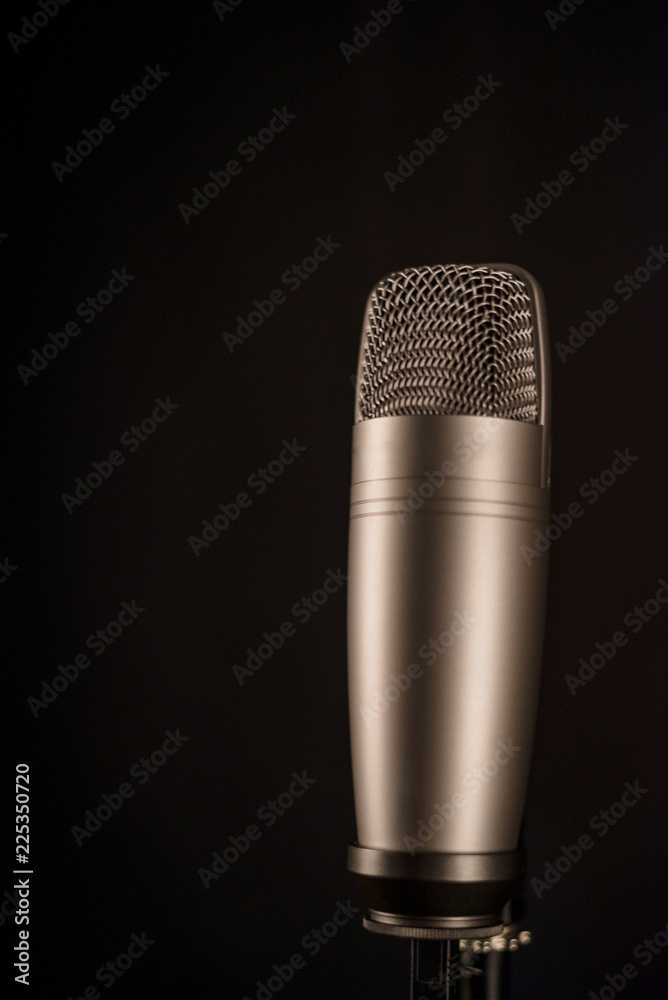 studio microphone on black background studio microphone on black background