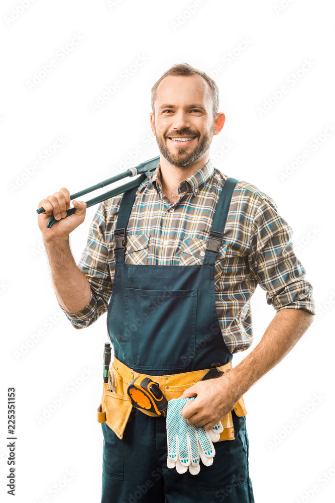 smiling plumber with tool belt holding monkey wrench and looking at camera isolated on white smiling plumber with tool belt holding monkey wrench and looking at camera isolated on white