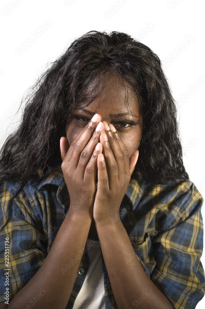 young sad and depressed black African American woman crying anxious and overwhelmed feeling sick and stressed isolated on studio background suffering depression young sad and depressed black African American woman crying anxious and overwhelmed feeling sick and stressed isolated on studio background suffering depression