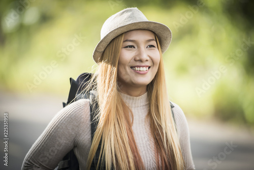 Young attractive woman backpack to traveling on her holiday. Woman lifestyle concept. © Johnstocker