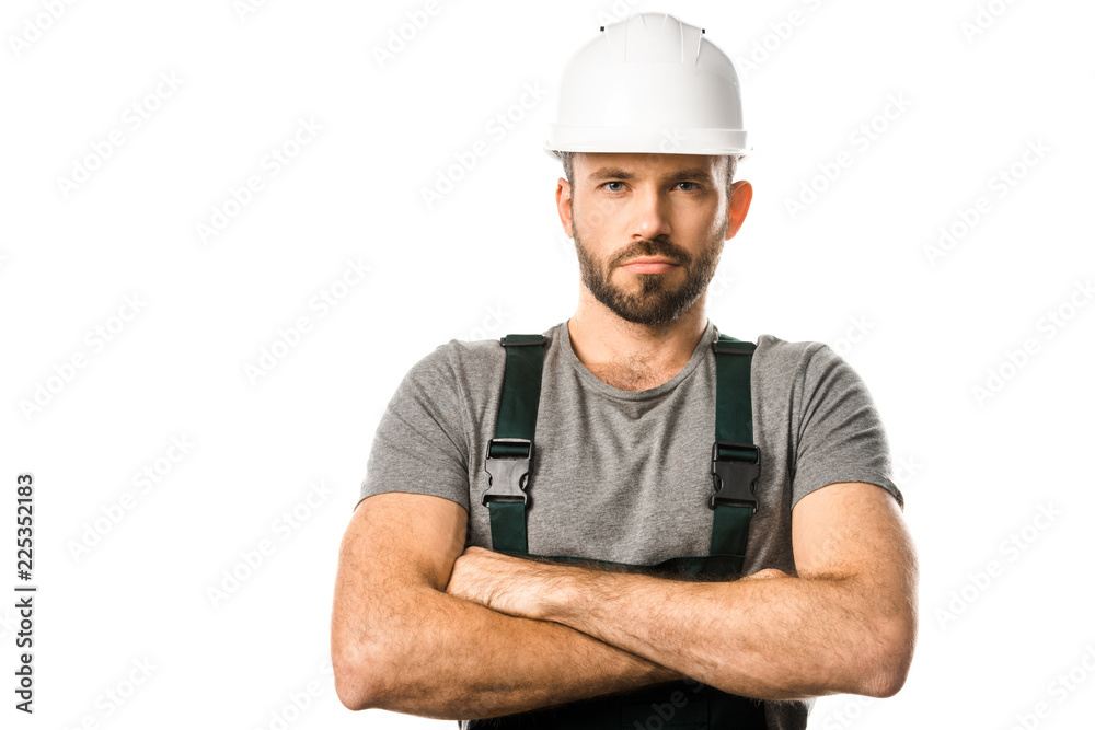 handsome plumber in helmet standing with crossed arms and looking at camera isolated on white handsome plumber in helmet standing with crossed arms and looking at camera isolated on white