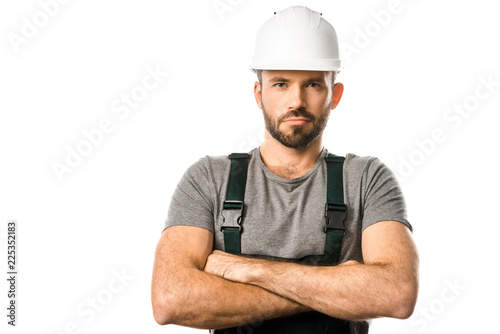 Wallpaper Mural handsome plumber in helmet standing with crossed arms and looking at camera isolated on white Torontodigital.ca