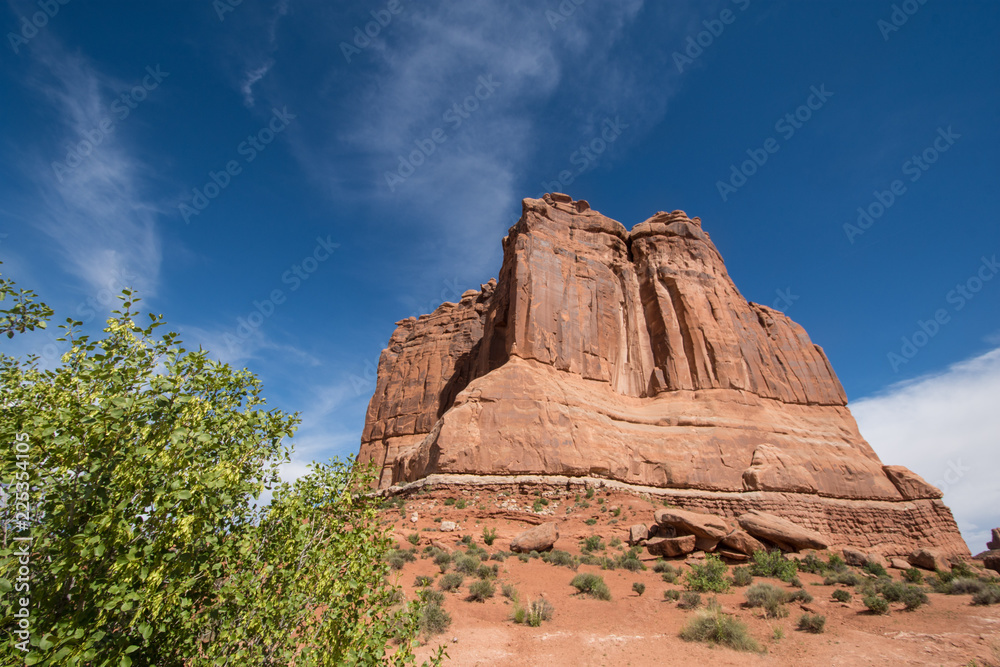 Fototapeta premium Giant red rock formations inside of Utahs Arches National Park. Blue sky and clouds