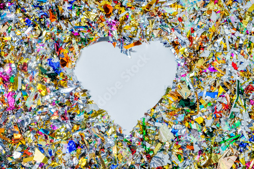 heart shaped frame of festive shiny confetti