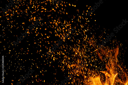 Fire sparks with flames on black background