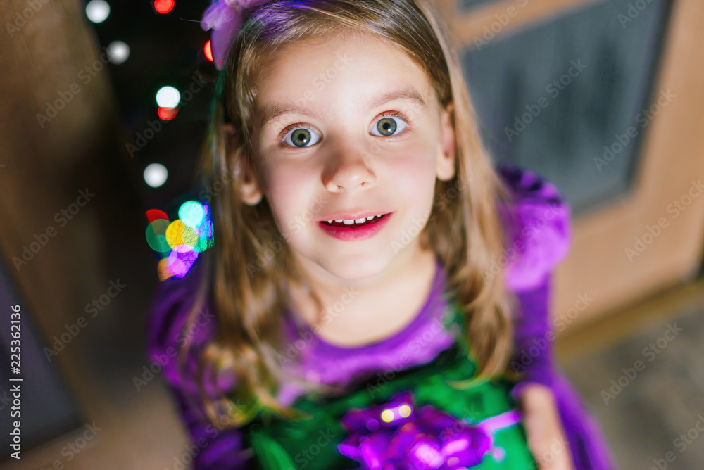 Merry Christmas! Happy child girl with christmas gift at evening home. Merry Christmas! Happy child girl with christmas gift at evening home.