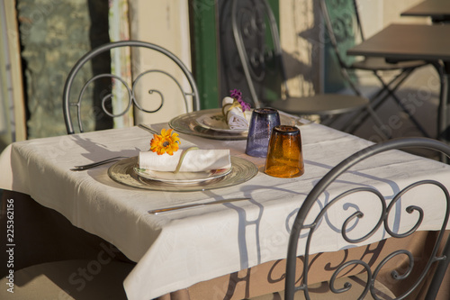 image of a table for two of restaurant in preparation for dinner with cutlery and glasses
