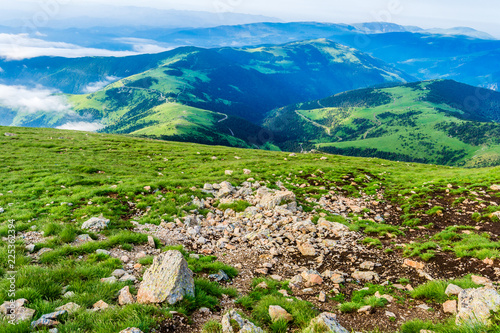 Hiking in the mountains (Catalan Pyrenees, Peak of Costabona, Catalonia, Spain) photo