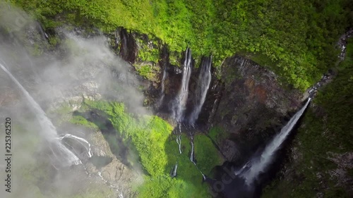Aerial view of waterfalls and people canyoneering in Reunin island. photo