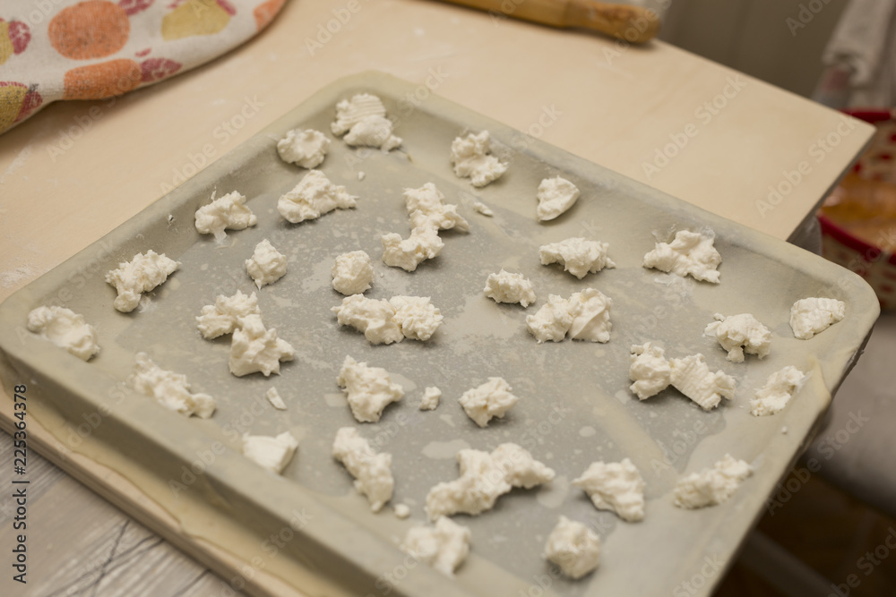 horizontal image of focaccia preparation with cheese