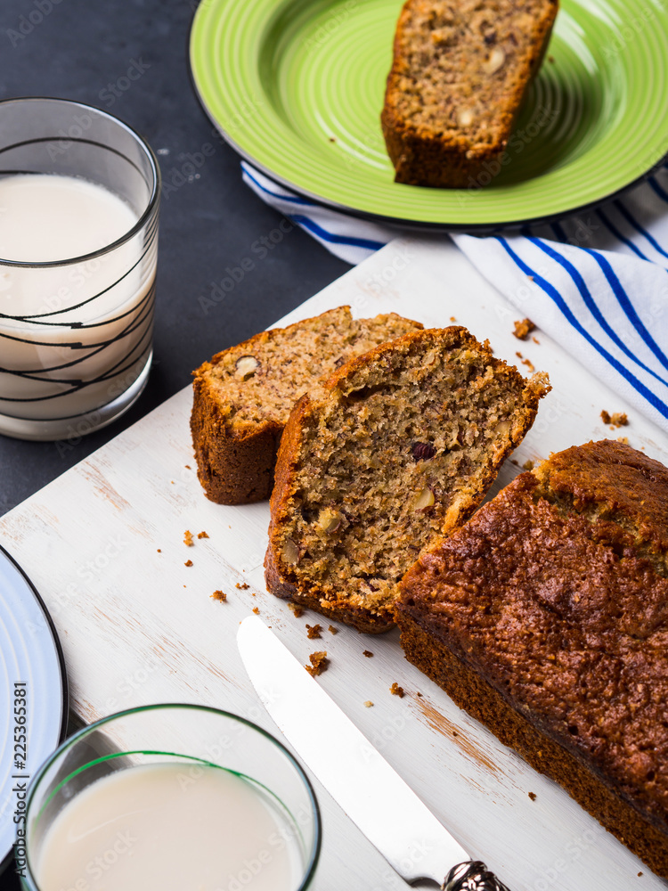 Whole grain banana bread for breakfast on white wooden board Whole grain banana bread for breakfast on white wooden board