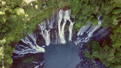 Aerial view of waterfalls and people canyoneering in Reunin island. photo