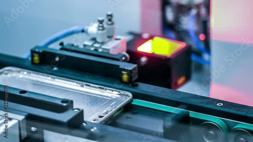 Automated machine in a smartphone assembly line.Seamless loop.