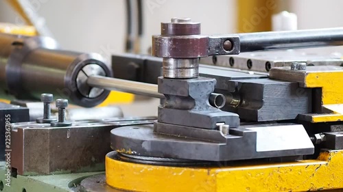 Bending the pipes in the factory.
