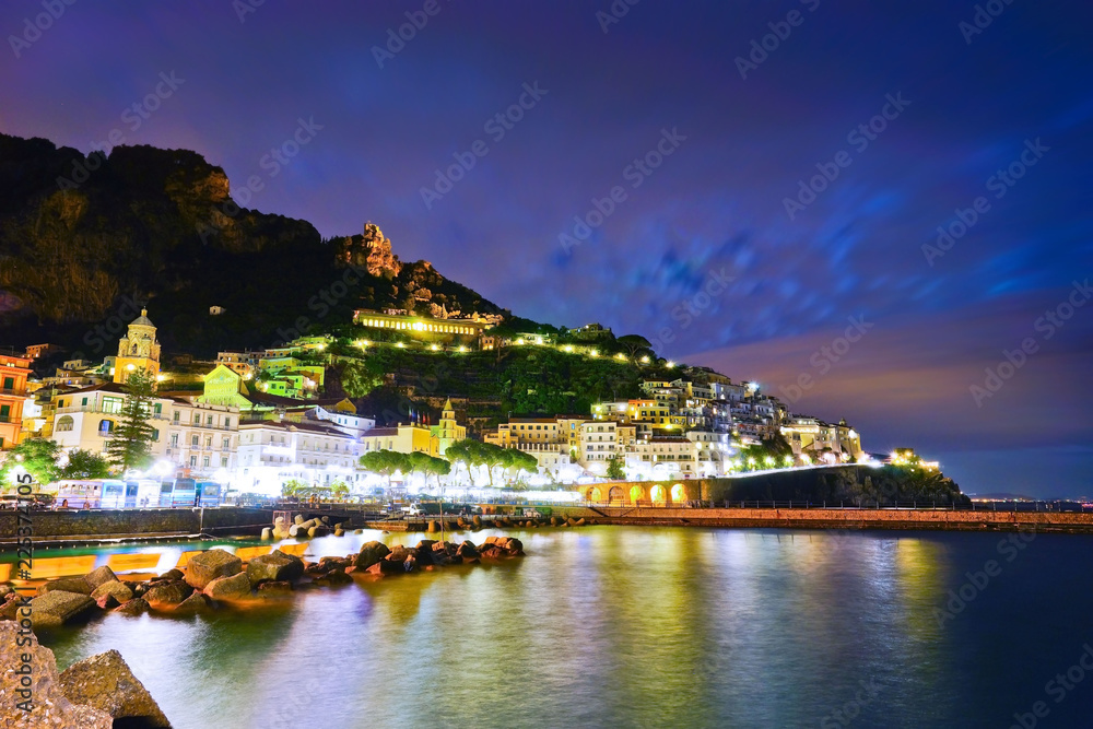 View of Amalfi village along Amalfi Coast in Italy at night.