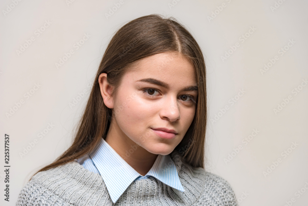 Portrait of a teen girl on a white background in various poses, smiling and looking happy. Portrait of a teen girl on a white background in various poses, smiling and looking happy.