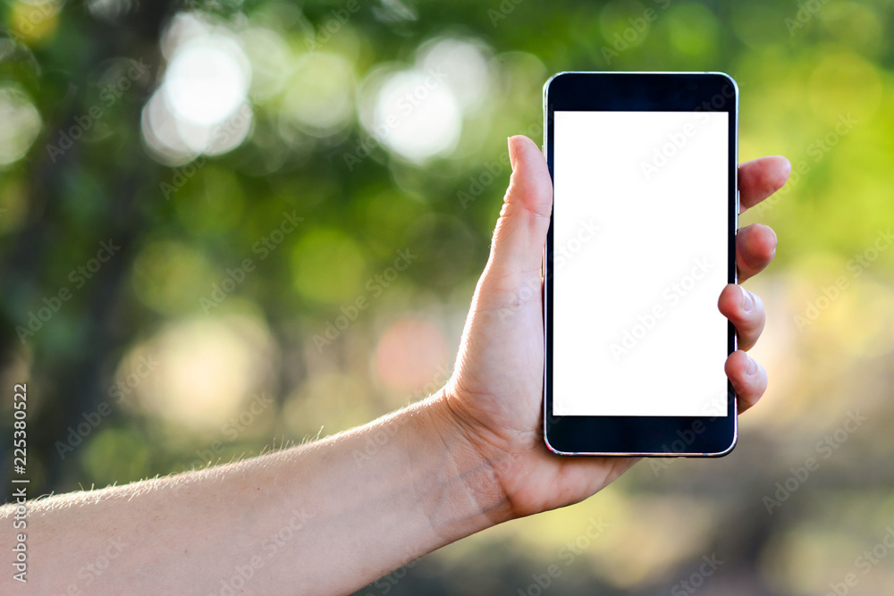 Smart Phone, Mobile Phone, Telephone, Text Messaging, Human Hand. Close up of a lady using mobile smart phone outdoor. Woman holding black mobile phone with blank white screen. Horizontal.