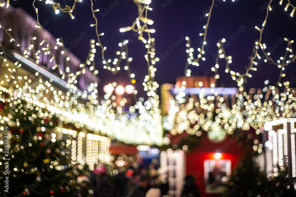 Christmas illumination, market shop, festively decorated. background blur