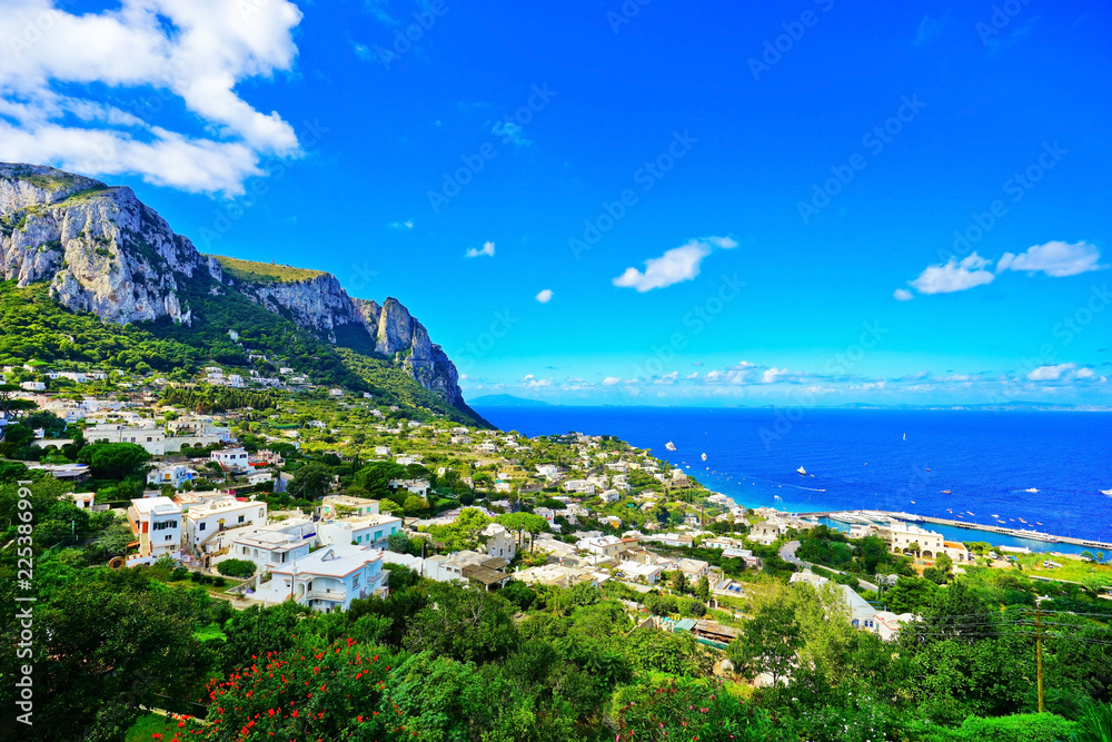 Overlooking the beautiful coastline of the island from city center of Capri in Italy in summer.
