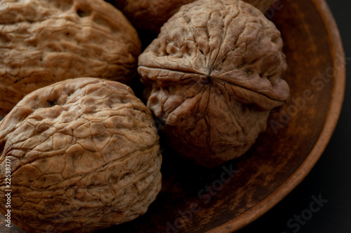 large walnuts on black background