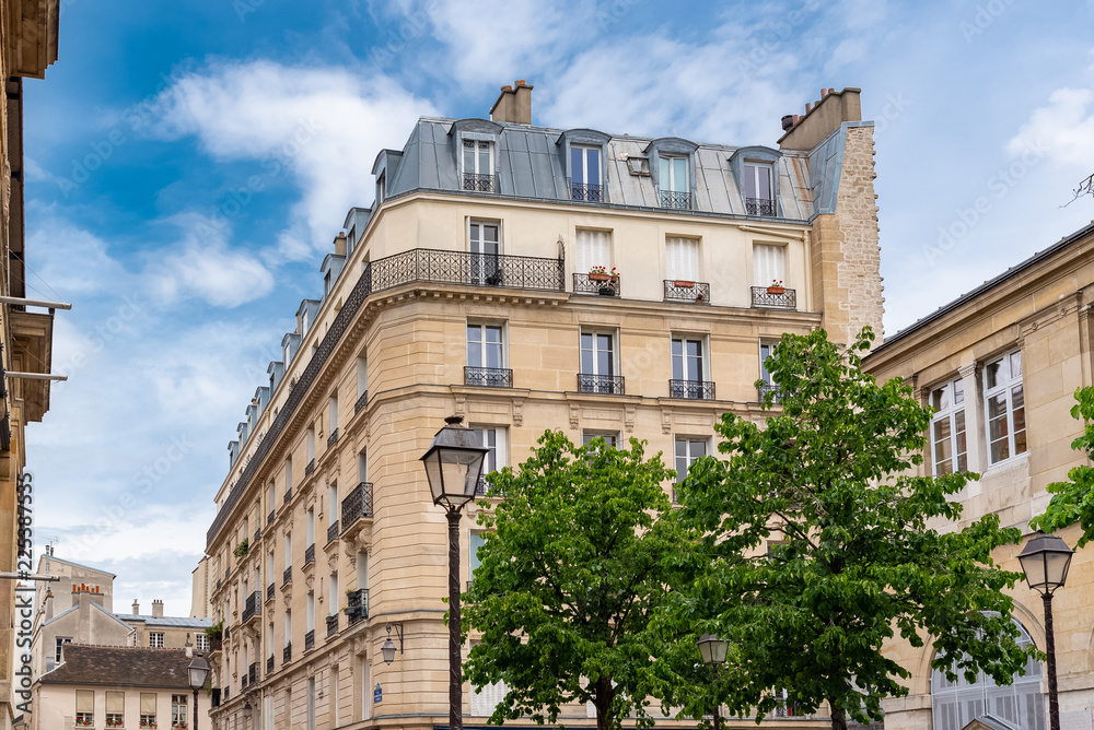 Paris, beautiful buildings, typical parisian facades in the Marais 
