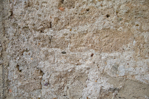 Fragment of an old brown wall. A fragment of an old clay wall in a background photo
