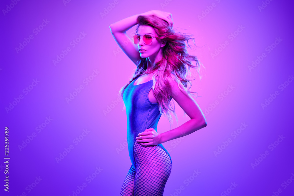 Fashion neon light. Girl with glowing Hairstyle