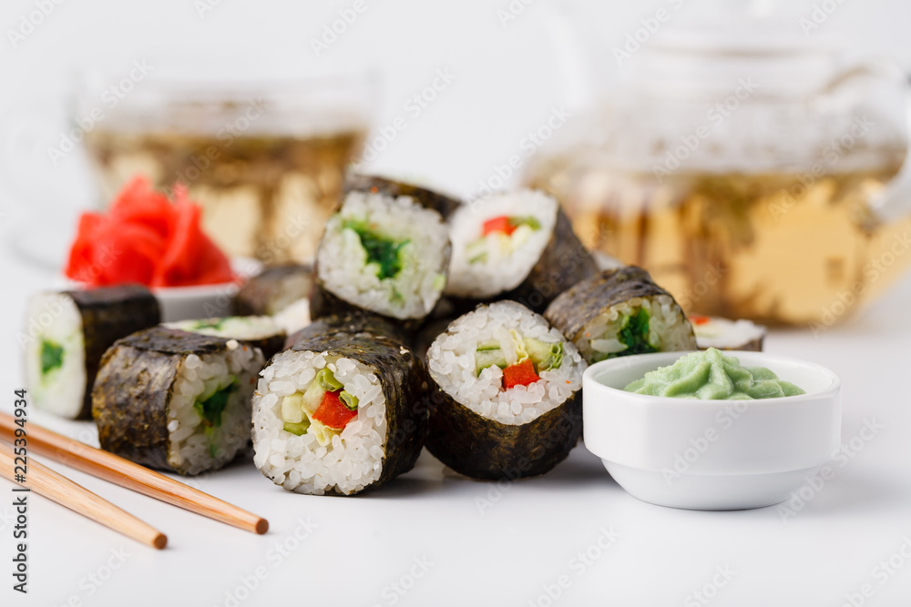 Japanese sushi set with green tea ready to serve Japanese sushi set with green tea ready to serve