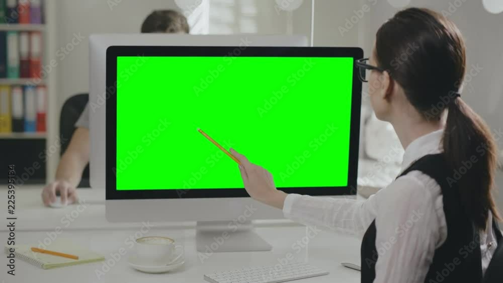 Female office manager showing presentation Female office manager showing presentation