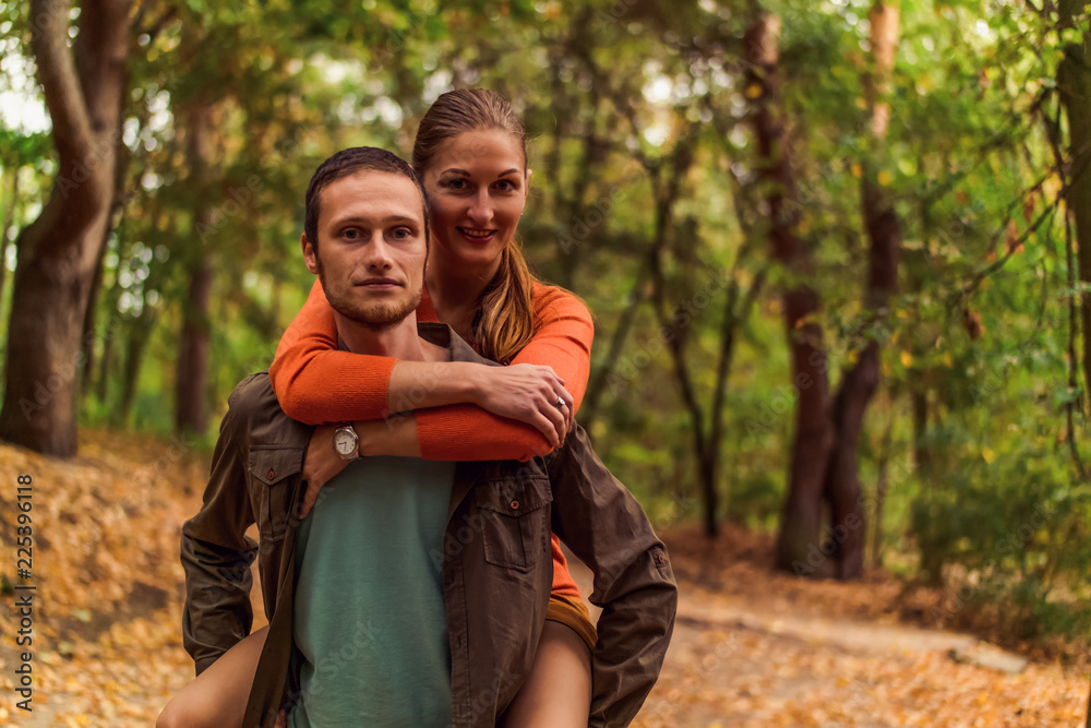 Portrait of couples against a backdrop of autumn forest Portrait of couples against a backdrop of autumn forest