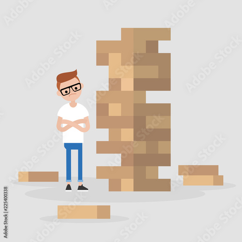 Young male character taking turn removing a block from a tower constructed of wooden bricks. Strategic thinking. Flat editable vector illustration, clip art
