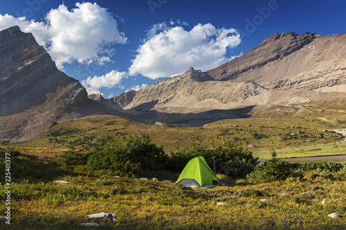 Camping Bivouac Tent near Devon Lake in remote Wilderness of Banff National Park, Canadian Rocky Mountains. Mt. Willingdon upper right