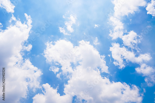 The vast blue sky with large group of fluffy clouds in sunny day of summer  peaceful skies background