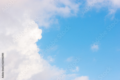 The vast blue sky with large group of fluffy clouds in sunny day of summer  peaceful skies background