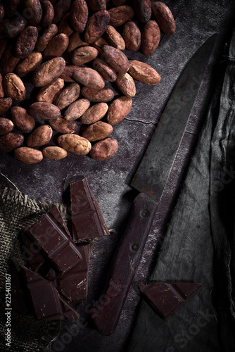 chocolate cocoa beans and old knife