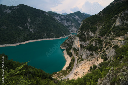 A beautiful view at the Piva lake  Pivsko jezero  going through a valley from a viewpoint located on a nearby hill. Municipality Plu  ine  Montenegro.