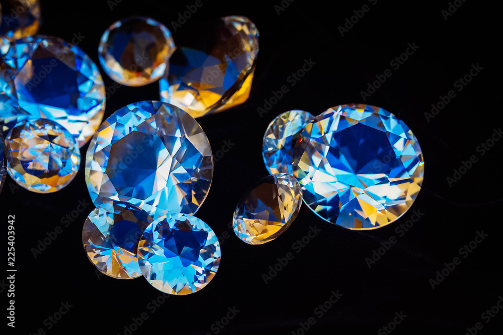 Pile of diamonds on black silk velvet background close up, retro toned Pile of diamonds on black silk velvet background close up, retro toned
