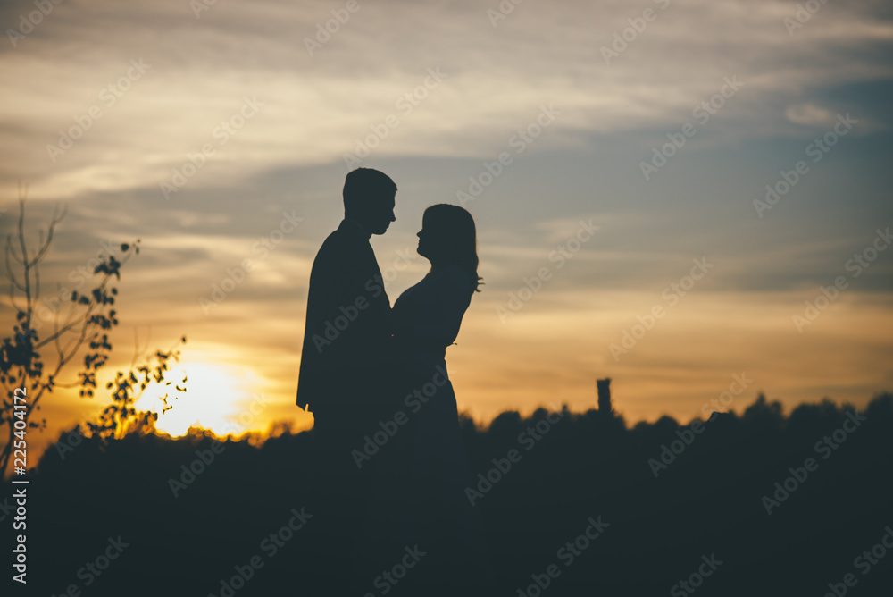 loving wedding couple hugging sihouette loving wedding couple hugging sihouette