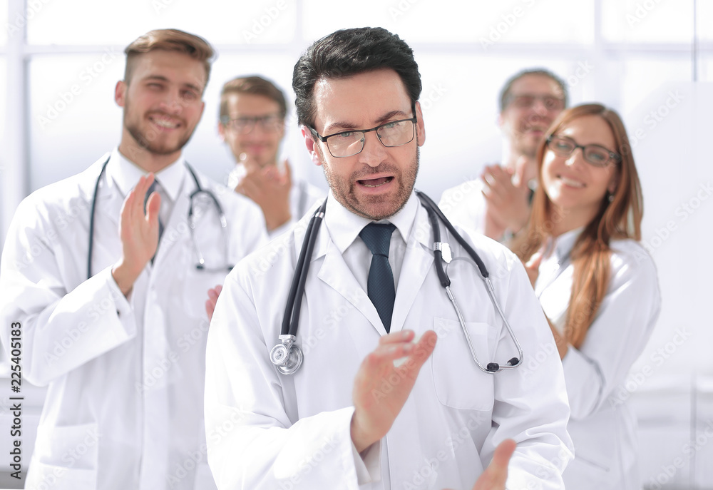 successful doctor, accepting congratulations from colleagues