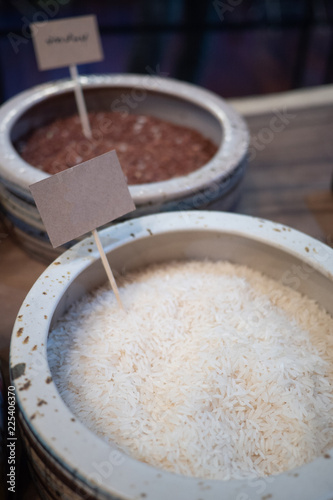 Close up of raw white Jasmine rice. A long-grain variety of Aromatic rice. Its fragrance reminiscent of pandan. Staple food of many country. Healthy eating and eat well concept. Mock up label ready.