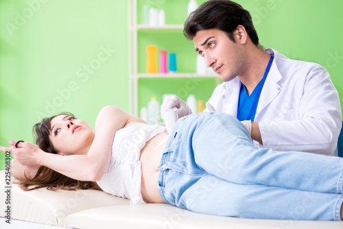 Pregnant woman visiting radiologyst for ultrasound 