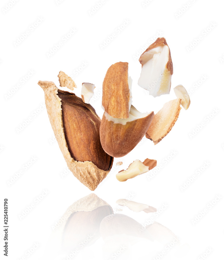Cracked almonds close-up isolated on white background Cracked almonds close-up isolated on white background