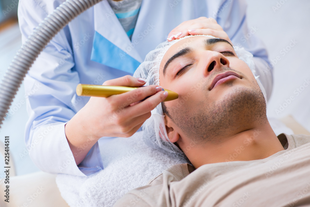 Man visiting dermatologyst for laser scar removal Man visiting dermatologyst for laser scar removal